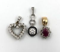 3 585 gold pendants, diamonds and rubies. 6.4 grams gross.Art Deco pendant with old cut diamond of
