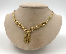 Gold 750 necklace with diamonds and rubies.Total weight 41.3 grams. The 3 diamonds together total