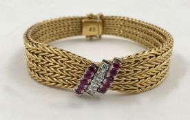 Gold 750 bracelet with diamonds and sapphires.Total weight 43.8 grams. The 5 diamonds together total