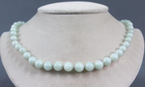 Jade necklace. Silver clasp, this gilded. Probably China circa 120 years old.Balls up to 10 mm in