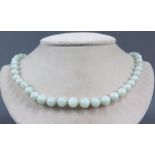 Jade necklace. Silver clasp, this gilded. Probably China circa 120 years old.Balls up to 10 mm in