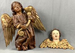 2 sculptures. Angels as candle holder and a putto,Up to 52 cm x 49 cm. Carved wood with polychrome