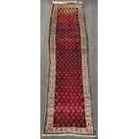 Hamadan Persian carpet. Iran. Antique, around 1910.352 cm x 108 cm. Knotted by hand. Wool on cotton.