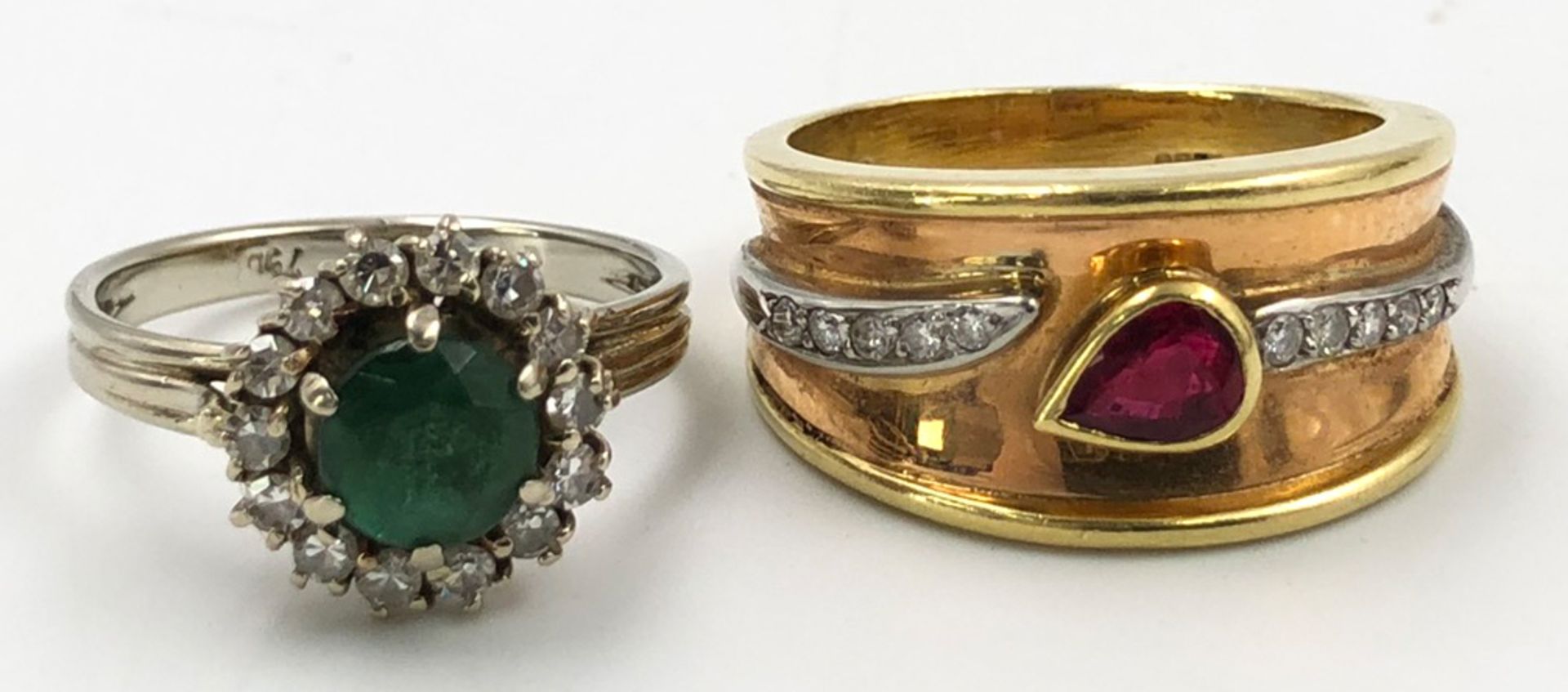 2 rings. 750 gold. 12.6 grams gross.Emerald (proably treated) surrounded by 15 brilliant-cut