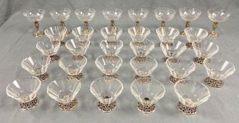 Silver with lead crystal glass cups. 23 ice cups and 8 champagne glasses.Up to 12 cm high. Proably