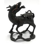 Qilin. Proably China, Qing dynasty. Bronze.13 cm x 7.5 cm x 12 cm. Opening under the lion's tail.
