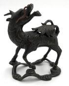 Qilin. Proably China, Qing dynasty. Bronze.13 cm x 7.5 cm x 12 cm. Opening under the lion's tail.