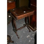 An early 19th century rosewood occasional table with cut brass inlay above a small frieze drawer