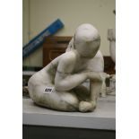 A sculpture of a kneeling woman in weathered alabaster [D] FOR DETAILS OF ONLINE BIDDING ON THIS LOT