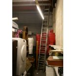 A long two-section extending aluminium ladder and a quantity of boxed sets of records. FOR DETAILS