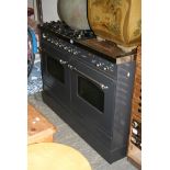 An impressive large and modern gas cooker by Ilve, model Britannia, providing four gas hobs, a large