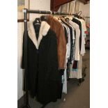 A rail of ladies' mainly designer clothing including dresses, jackets and coats, Armani, Vera
