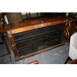 A good quality early 19th century rosewood open bookcase in the Empire style with inlaid and cut