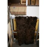 A large brown fur carpet and an Eastern patterned throw. [half landing] FOR DETAILS OF ONLINE