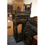 An unusual 19th century tall dressing cabinet with mirrored back above a cupboard of four shallow