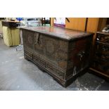 A good old Zanzibar chest in teak, liberally studded in brass and with cut brass lock plate and