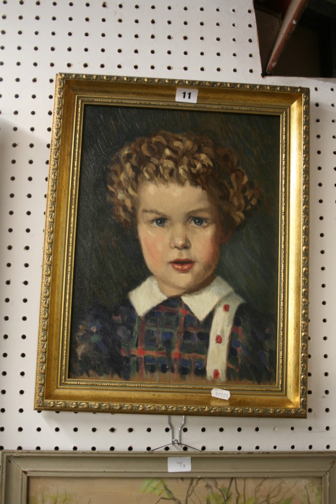 A mid-20th century oils on canvas portrait of a curly-haired child (39 x 29 cm), framed FOR