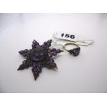 An amethyst star brooch and an amethyst ring. FOR DETAILS OF ONLINE BIDDING ON THIS LOT CONTACT