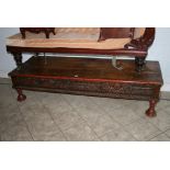 A fabulous large rectangular Eastern low table in hardwood, the frieze carved with exotic animals