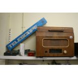 Two shelves of collectables, comprising a vintage Bush radio, a mahogany workbox, a student's