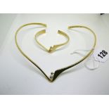 A Bent Gabrielsen for Georg Jensen 18 ct gold collarette and matching bangle, each set with two