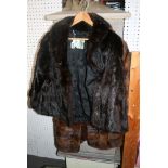 A Norman Hartnell lady's dark brown mink fur jacket with swing back, shawl collar and Norman