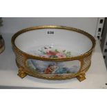 An attractive oval porcelain bowl in Sevres style, painted with a panel of lovers signed Delys,