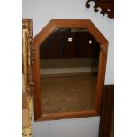 A modern wall mirror in a moulded pine frame. FOR DETAILS OF ONLINE BIDDING ON THIS LOT CONTACT