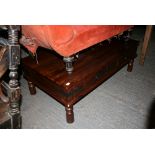 An Indian hardwood rectangular coffee table with four frieze drawers and metal strapwork. FOR
