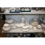 An extensive Royal Doulton bone china table service comprising coffee jug and coffee cans, tureens
