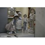 Three Nao figurines of children plus another similar [s1] FOR DETAILS OF ONLINE BIDDING ON THIS