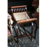An Edwardian piano stool of curved form on cabriole legs. FOR DETAILS OF ONLINE BIDDING ON THIS