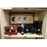 A collection of various binoculars, including Tonelle Prismatic binoculars, field glasses, a