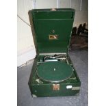 A His Master's Voice portable wind-up gramophone in green Rexine case, supplied by Harrods Ltd,