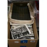 A cardboard box full of postcards mainly topographical and items of interest, old share certificates