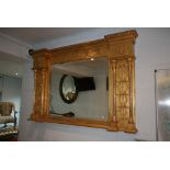 An impressive Victorian overmantel mirror in gilt of Adams style with ribbons and fronds of