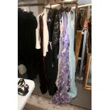 A collection of ladies clothing, mainly evening wear, including Ben de Lisi, Caroline Charles,