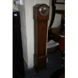 An oak-cased Grandmother clock chiming on a gong. FOR DETAILS OF ONLINE BIDDING ON THIS LOT