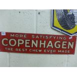 A red ground tinplate Copenhagen Tobacco advertising sign stating 'More satisfying Copenhagen the
