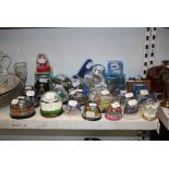 A large collection of snow globes from cities around the world. [s14] FOR DETAILS OF ONLINE