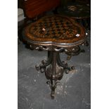 A pretty 19th century occasional table the heart-shaped top gilt painted with a checkerboard above a