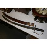 A Victorian cutlass, the broad curved blade with AR monogram and indistinct Birmingham maker's