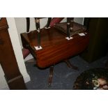 A good quality mahogany Regency pedestal Pembroke table with cross-banded decoration above a