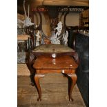 An ornate carved late Victorian open arm chair on cabriole legs, a walnut small table, three