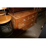 A Victorian stripped pine chest of two short over two long drawers with glass pulls. FOR DETAILS