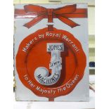 An enamel Jones Sewing Machines advertising sign saying 'By Royal Warrant' in large letters with