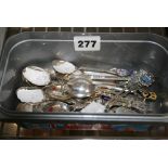 A collection of silver souvenir teaspoons, almost all enamelled, mainly English, but some
