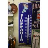 A blue ground enamel Ferrania advertising sign, a thermometer, missing its glass, Italian
