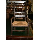 A Victorian elm child's miniature Windsor armchair in the Dales style with spindle back and wings
