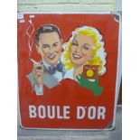 A red ground enamel Boule D'Or advertising sign with a picture of a man and woman smoking Belgium